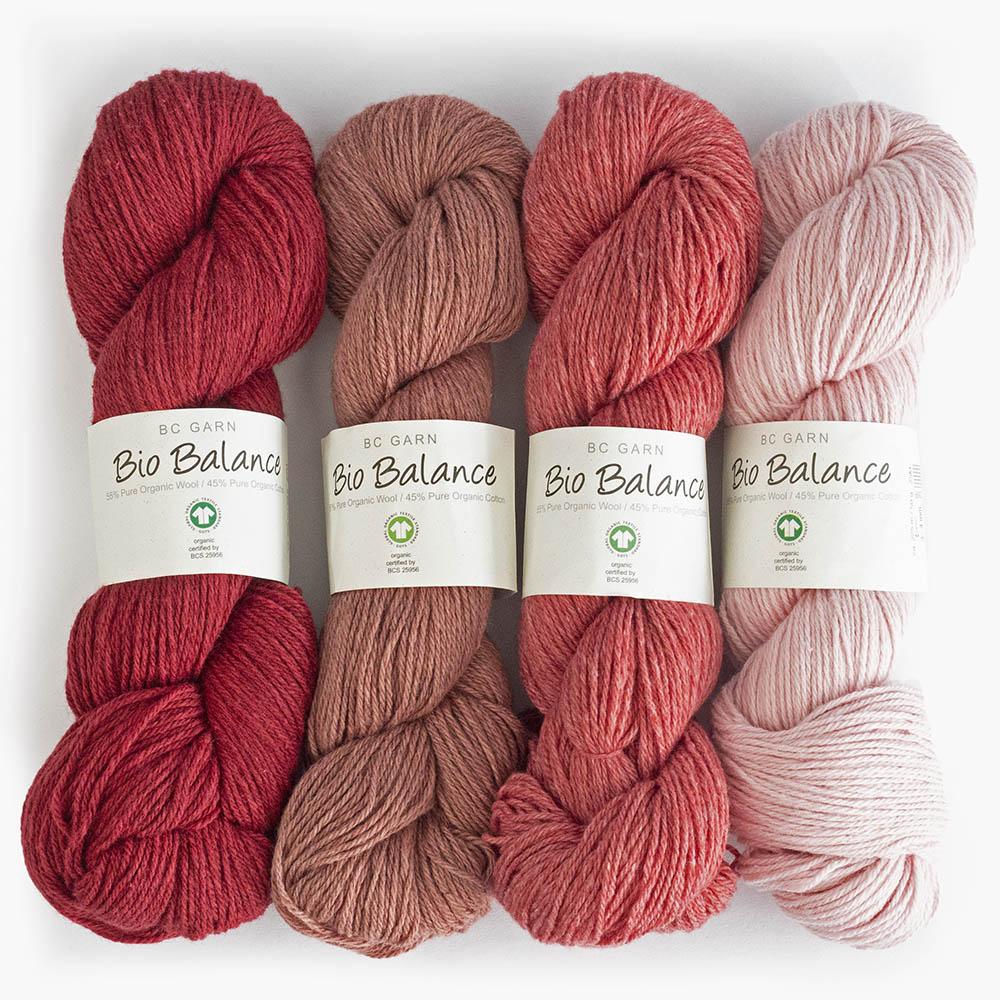 4 écheveaux de fil à tricoter Bio Balance de BC GARN dans différents tons de rouge et rose